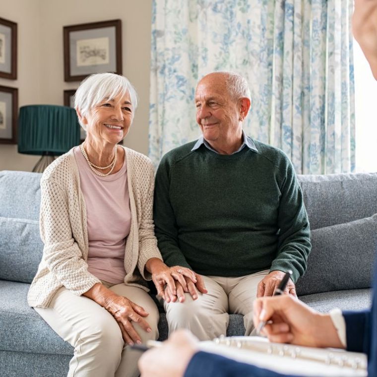Care worker supporting an elderly resident in a calm care home setting